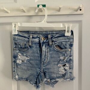 Ripped light colored shorts